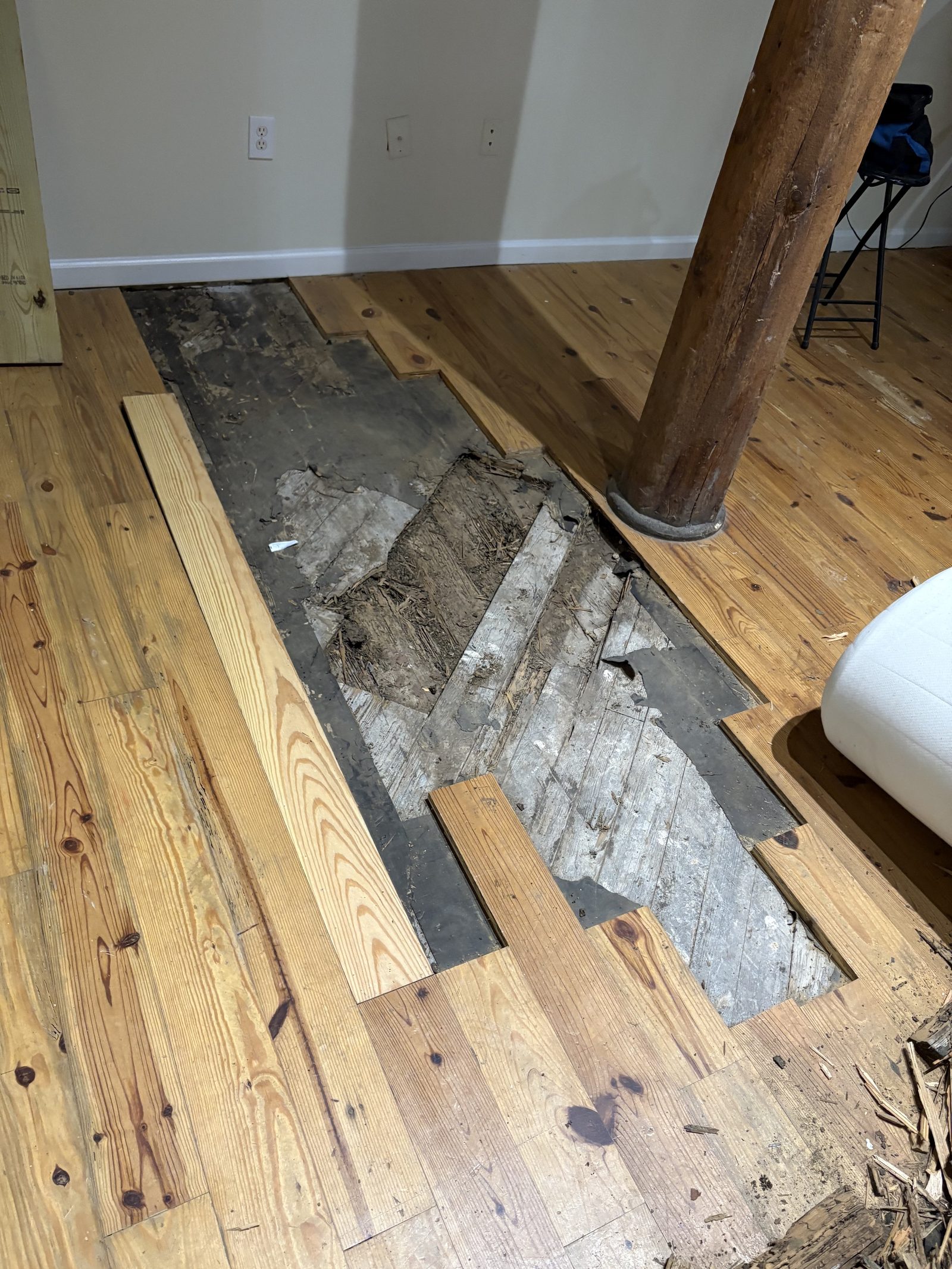 Damaged wood floor opened for repair
